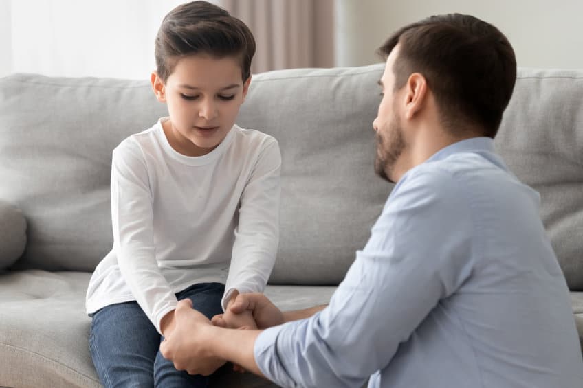 Worried single father comforting upset kid son helping with problem Holding Hand